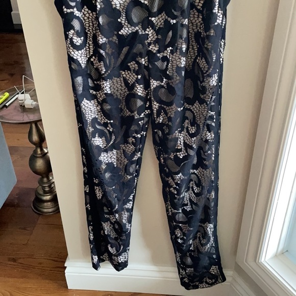 DVF SHANY BLACK LACE JUMPSUIT 6. Bought on Poshmark but it sadly does not fit. - Picture 8 of 12